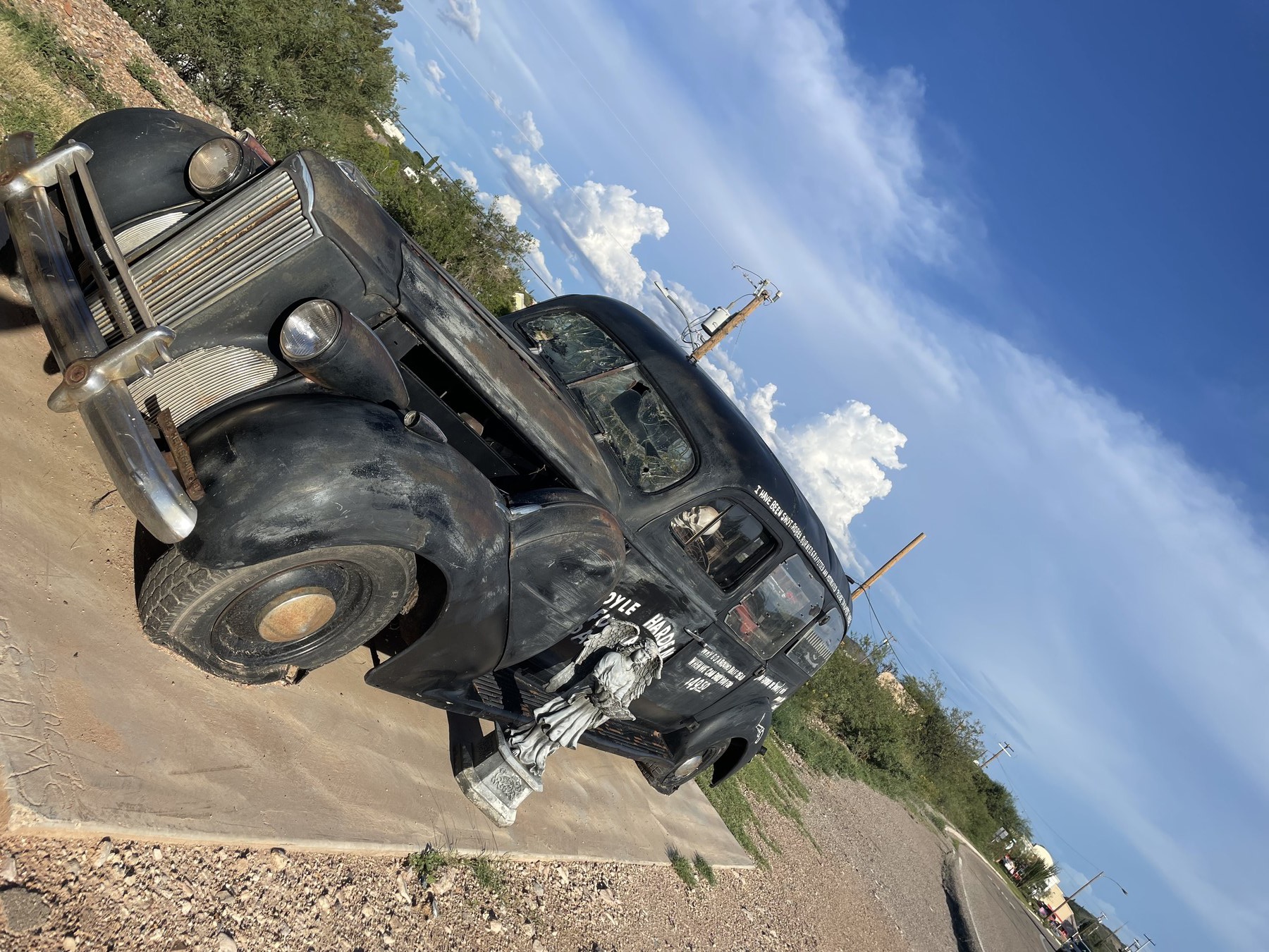 Serafina's road-trip vehicle on a desert road.