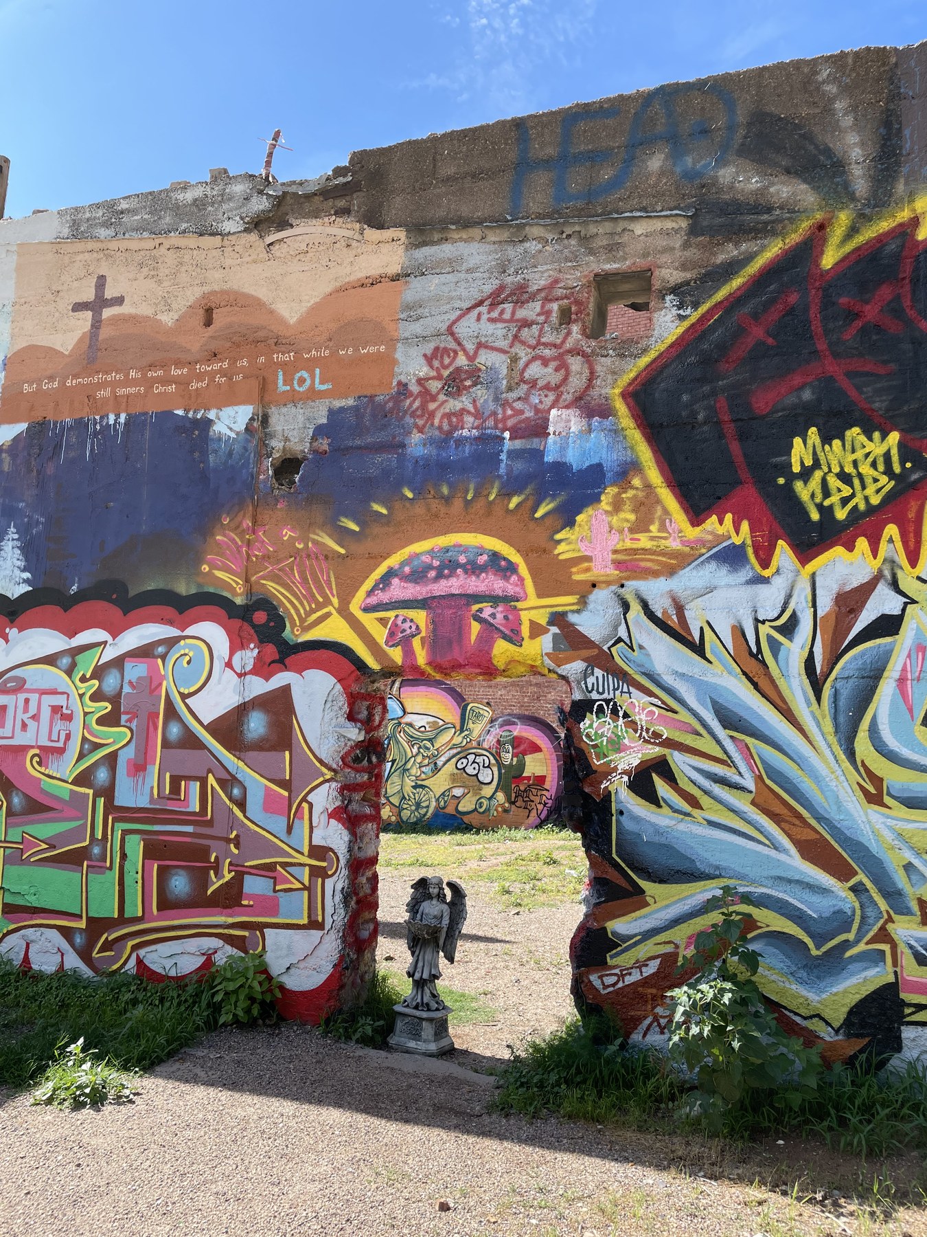 Serafina before a bright mural wall.